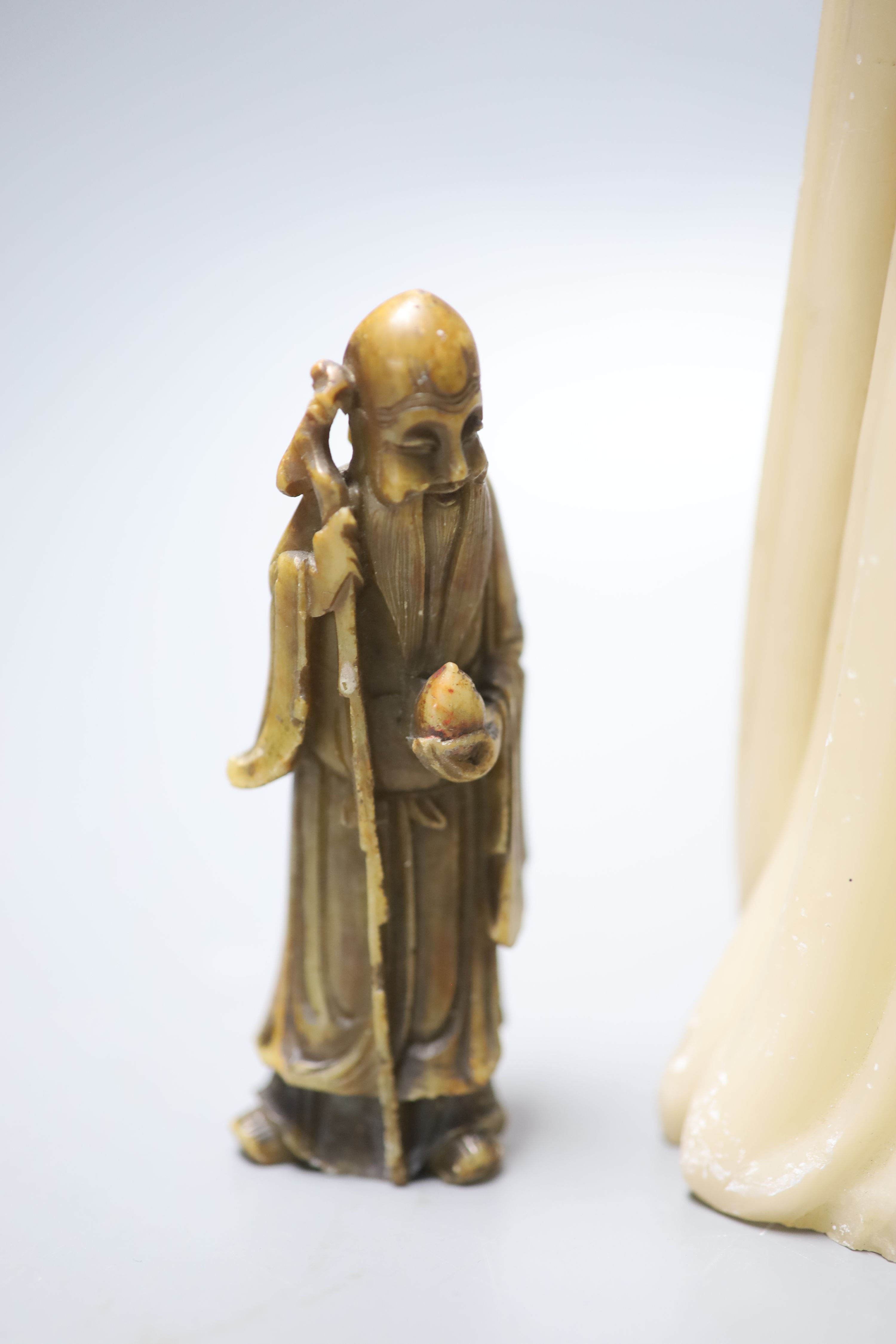 A large Chinese cream soapstone figure of an immortal, 41.5cm, (damaged) and a smaller 19th century Chinese russet soapstone figure of